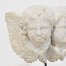 Carved white marble winged double angle head ornament, Italy circa 1750