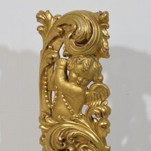 Large hand carved giltwood baroque curl ornament with angel, Italy circa 1750