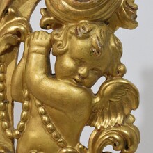 Large hand carved giltwood baroque curl ornament with angel, Italy circa 1750
