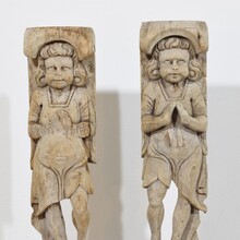 Pair of weathered oak renaissance angel figure ornaments, France 17th century