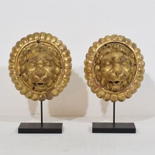 Pair Neoclassical giltwood lion head medaillons, France circa 1780