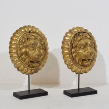 Pair Neoclassical giltwood lion head medaillons, France circa 1780