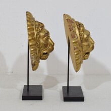 Pair Neoclassical giltwood lion head medaillons, France circa 1780