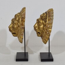 Pair Neoclassical giltwood lion head medaillons, France circa 1780