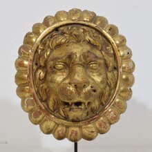 Pair Neoclassical giltwood lion head medaillons, France circa 1780