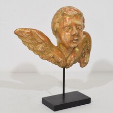 Small baroque carved giltwood angelhead on wings, France circa 1750