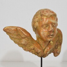 Small baroque carved giltwood angelhead on wings, France circa 1750