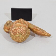 Small baroque carved giltwood angelhead on wings, France circa 1750