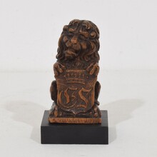 Small hand carved lion sculpture with coat of arms, France circa 1650-1750