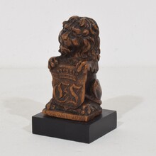 Small hand carved lion sculpture with coat of arms, France circa 1650-1750