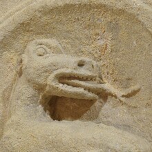 Medieval carved stone fragment depicting a dragon/ mythical figure, Spain circa 1250-1450